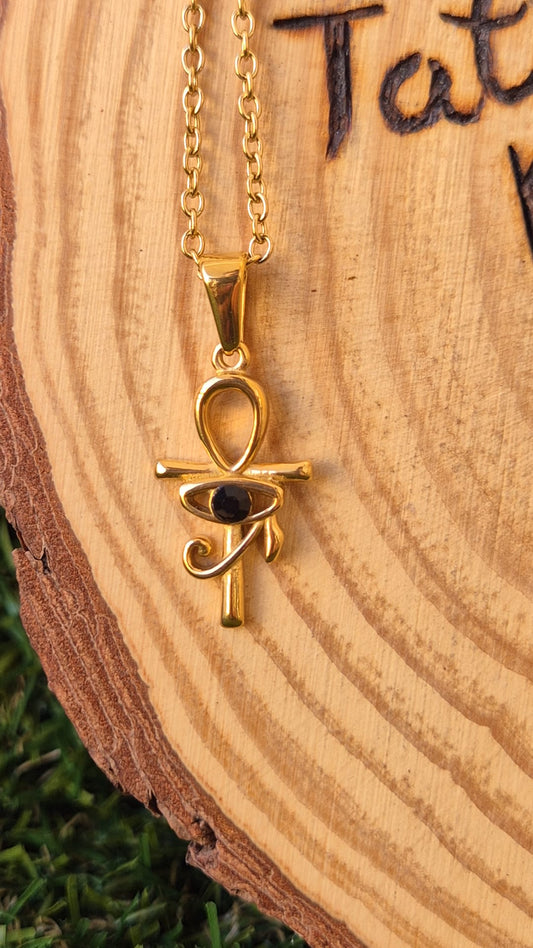 Colgante Cruz de la Vida con Ojo de Horus y Ónix en Acero Dorado - Protección y Energía Egipcia