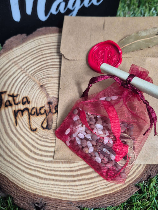 saquito I-ching para la abundancia ritualizado con monedas y símbolos energéticos Tata Magic