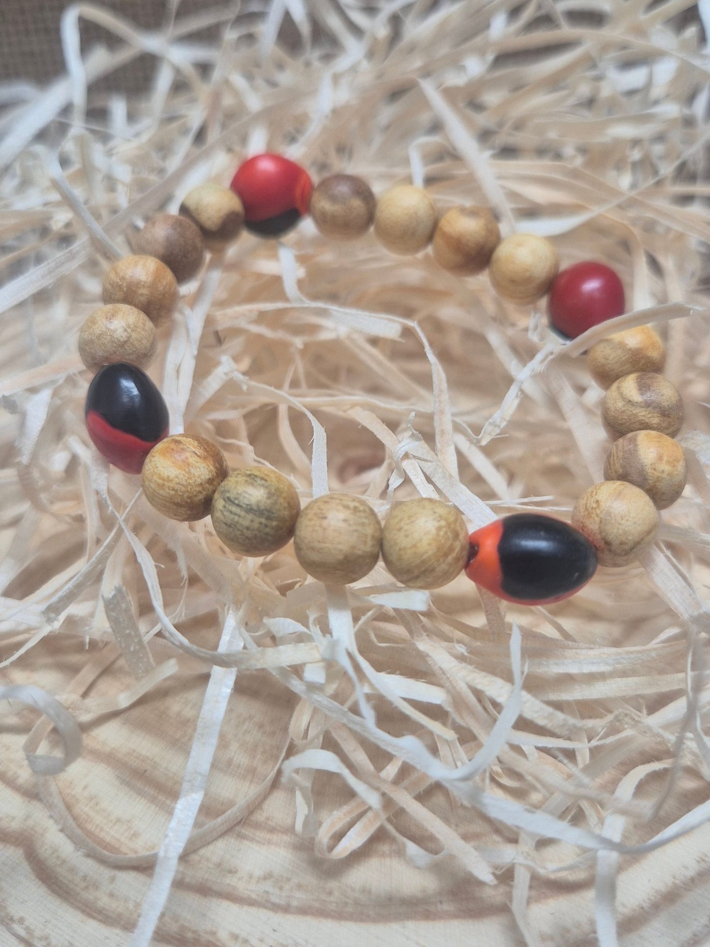 Pulsera Protección Huayruro y palo santo (peonía) consagrada Tienda esotérica Málaga - La Tienda de Tata Magic: tienda Esotérica en Málaga